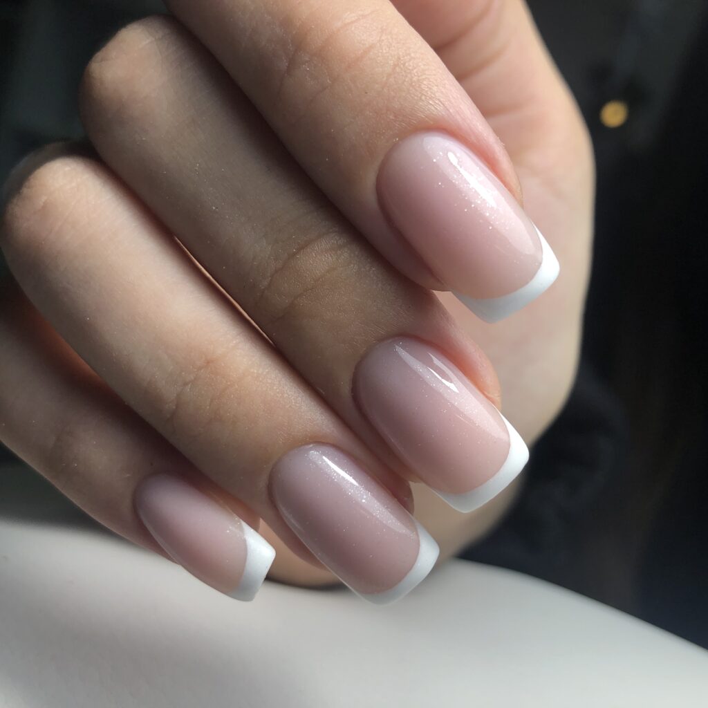 french manicure on the nails. french manicure design. manicure gel nail polish
